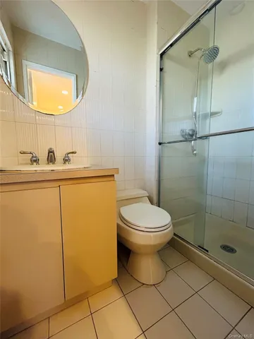 a bathroom with a toilet sink and shower