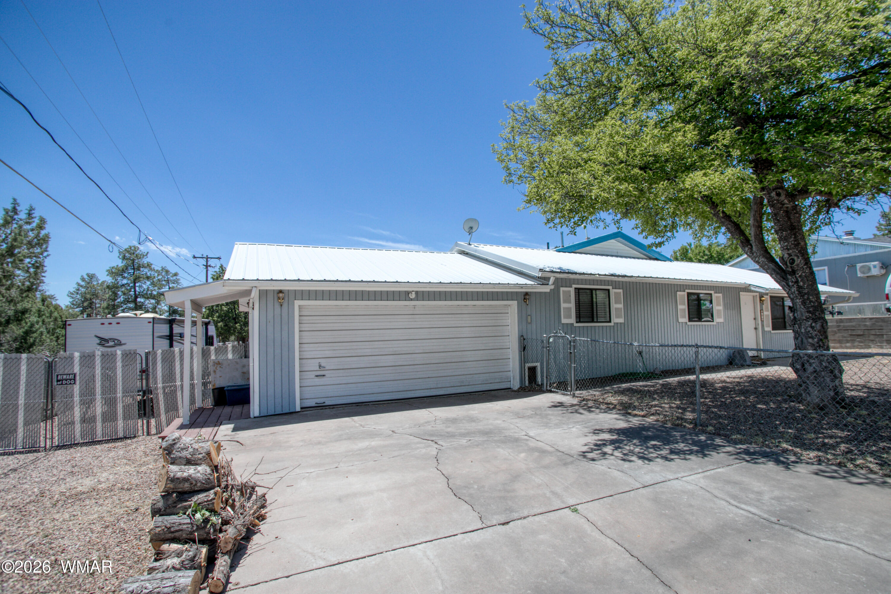 411 West Stratton Show Low, AZ 85901 - Photo 29 of 47 a front view of a house with a garage
