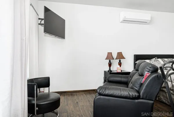 a living room with furniture and a chair