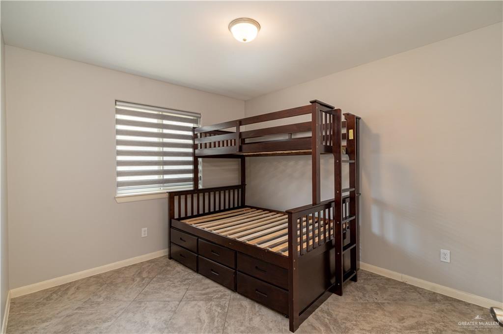 412 South Paseo Del Rey Street Mission, TX 78572 - Photo 8 of 15 Bedroom featuring baseboards