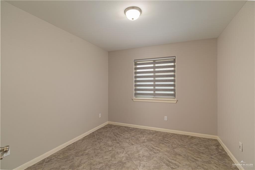 412 South Paseo Del Rey Street Mission, TX 78572 - Photo 9 of 15 Empty room with baseboards