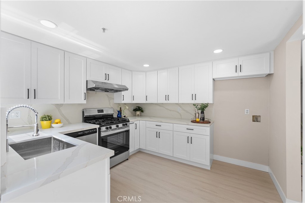 150 Diamond Street, Unit B Arcadia, CA 91006 - Photo 17 of 49 a kitchen with a stove a sink and a refrigerator
