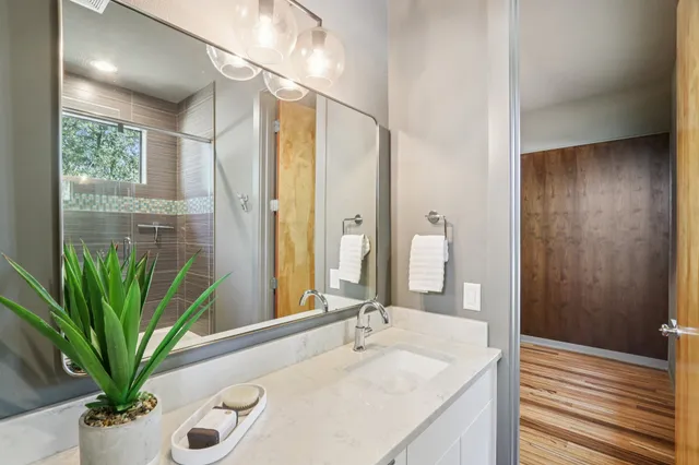 a bathroom with a toilet a sink and shower