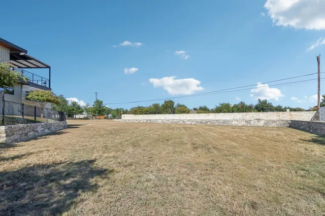 a view of a yard with trees