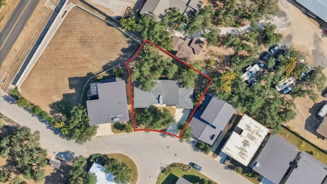 a view of a playground with a house