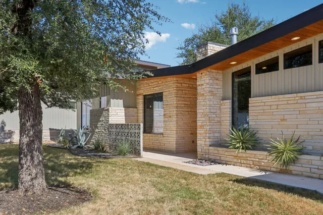 a view of a kitchen with a sink and a fireplace