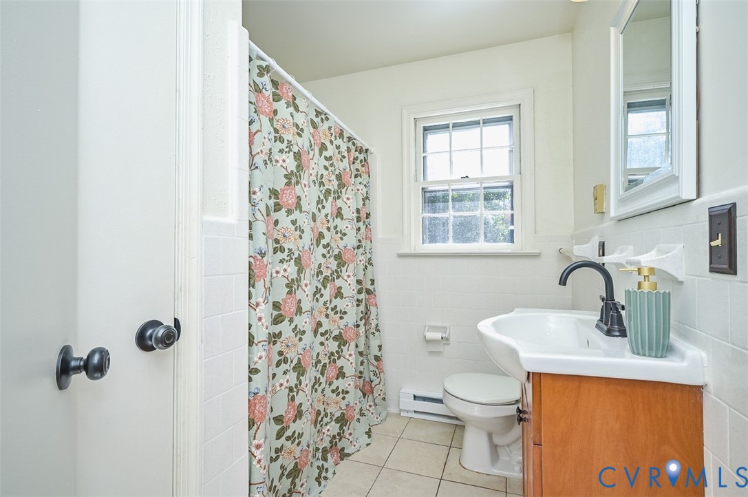11331 Winterpock Road Chesterfield, VA 23838 - Photo 20 of 49 a bathroom with a toilet sink and shower
