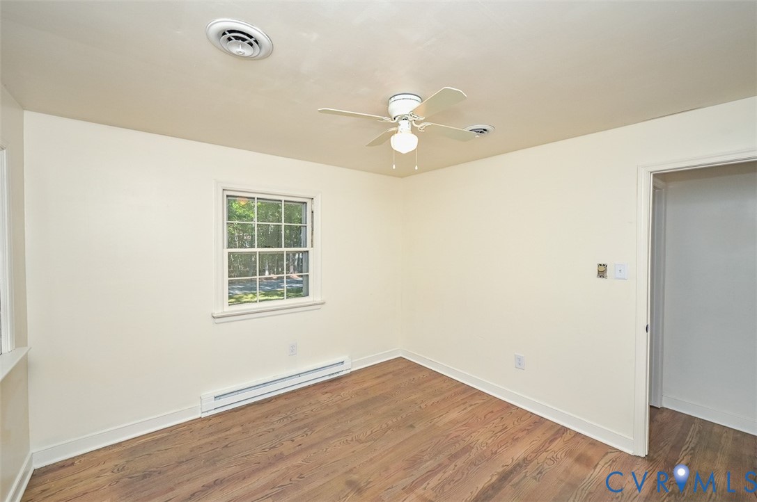 11331 Winterpock Road Chesterfield, VA 23838 - Photo 24 of 49 an empty room with wooden floor and windows
