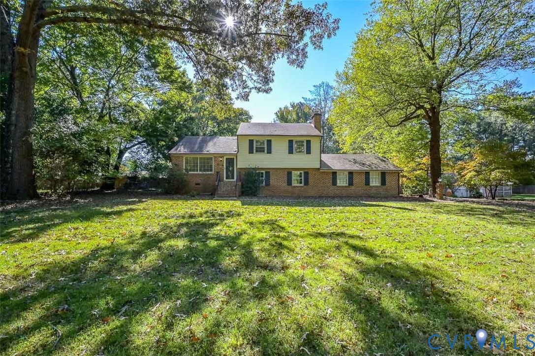 11331 Winterpock Road Chesterfield, VA 23838 - Photo 3 of 49 a front view of a house with a garden
