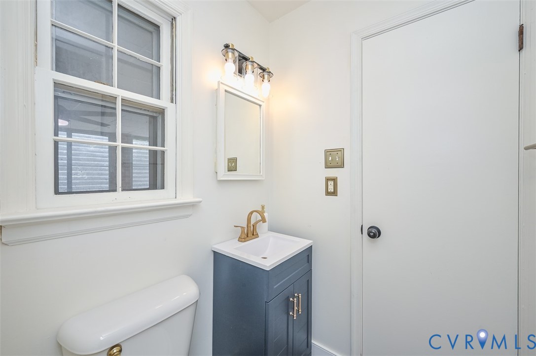 11331 Winterpock Road Chesterfield, VA 23838 - Photo 35 of 49 a bathroom with a toilet a sink and a mirror