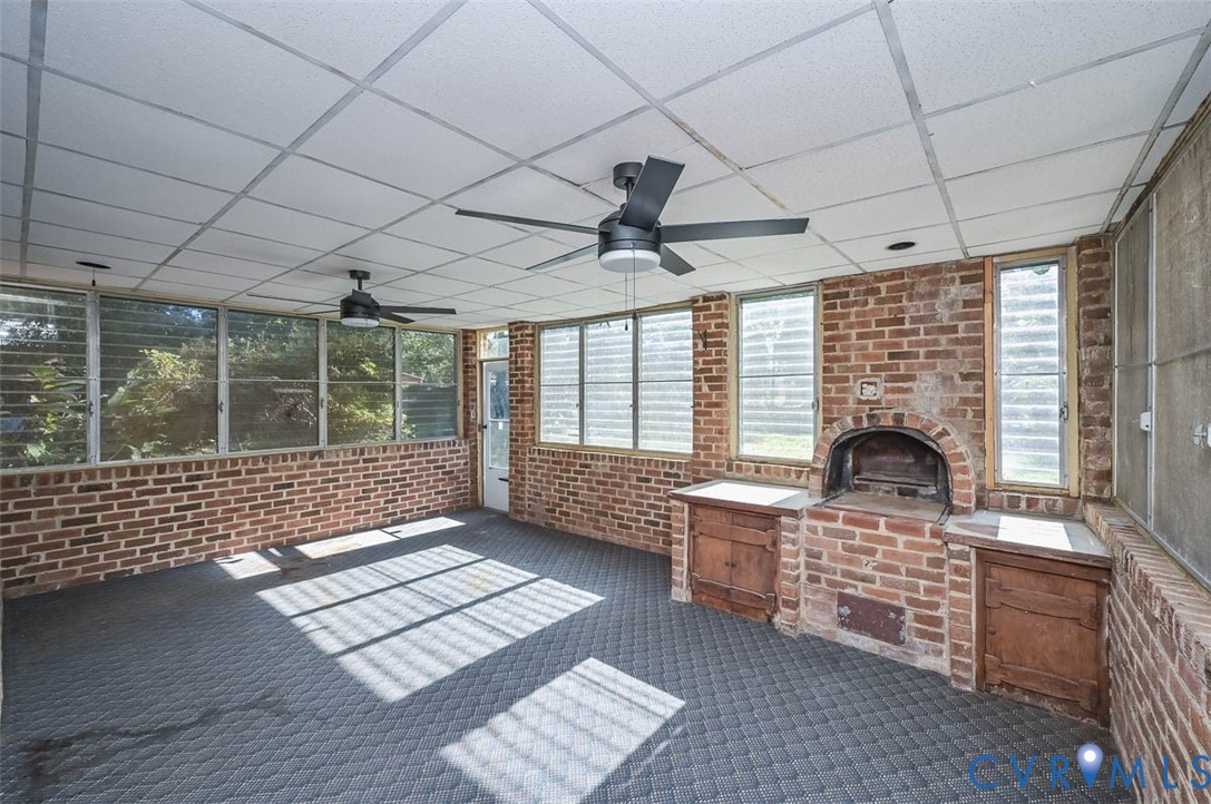 11331 Winterpock Road Chesterfield, VA 23838 - Photo 40 of 49 a living room with furniture and a floor to ceiling window