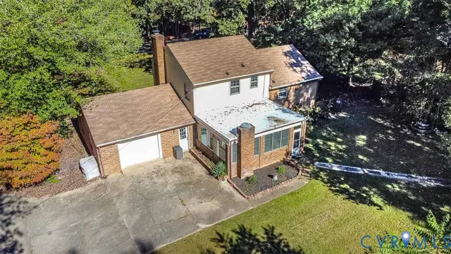 an aerial view of houses with yard