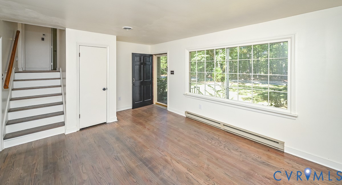 11331 Winterpock Road Chesterfield, VA 23838 - Photo 6 of 49 a view of a room with wooden floor and windows