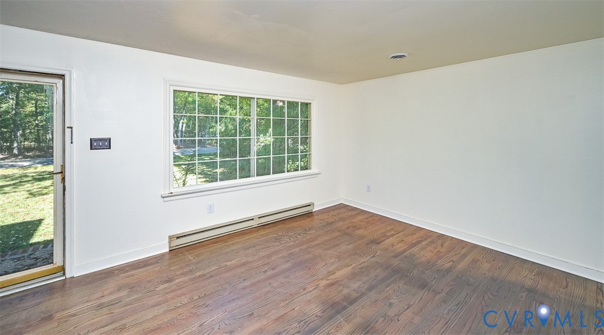 11331 Winterpock Road Chesterfield, VA 23838 - Photo 8 of 49 an empty room with wooden floor and windows