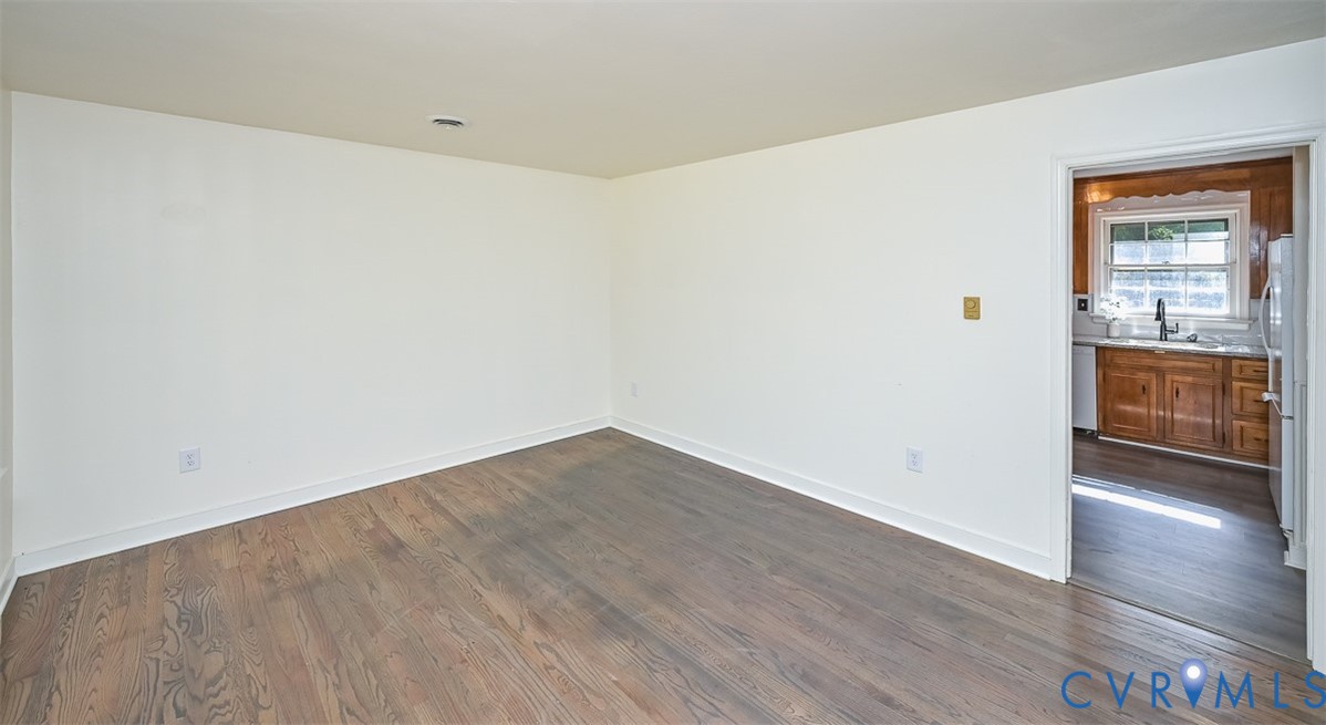 11331 Winterpock Road Chesterfield, VA 23838 - Photo 9 of 49 a view of an empty room with wooden floor and a window