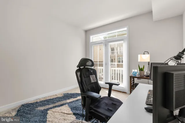 a view of a livingroom with furniture and a window