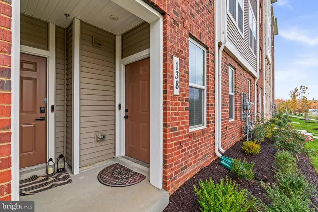 a view of a door with a door and a tree