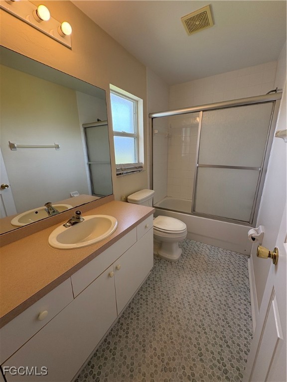 1635 Southwest 32nd Terrace Cape Coral, FL 33914 - Photo 11 of 15 a bathroom with a sink and a mirror