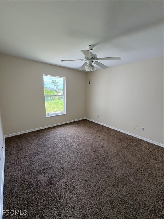 1635 Southwest 32nd Terrace Cape Coral, FL 33914 - Photo 12 of 15 an empty room with windows and fan