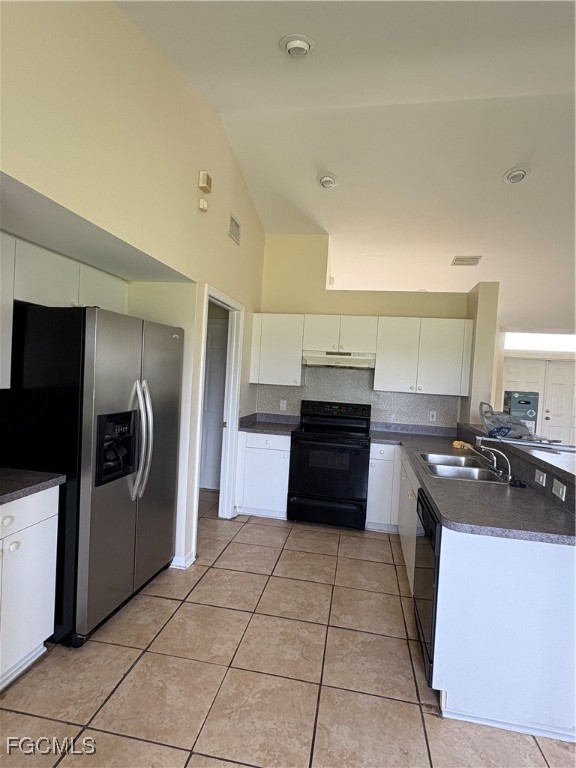 1635 Southwest 32nd Terrace Cape Coral, FL 33914 - Photo 3 of 15 a kitchen with stainless steel appliances a stove a sink and a refrigerator