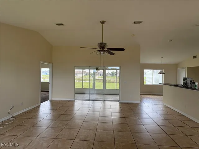 an empty room with a empty space and windows