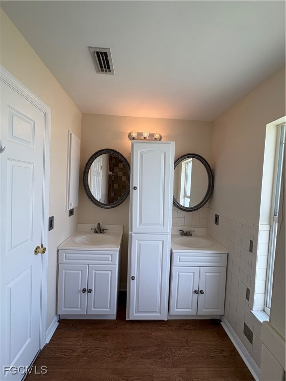 1635 Southwest 32nd Terrace Cape Coral, FL 33914 - Photo 10 of 15 a bathroom with a toilet a sink a mirror and vanity