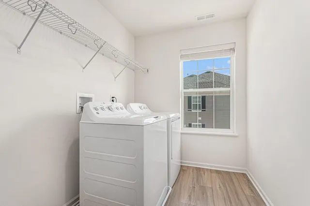 a utility room with a window dryer and washer