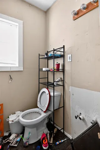 a bathroom with a toilet and a sink