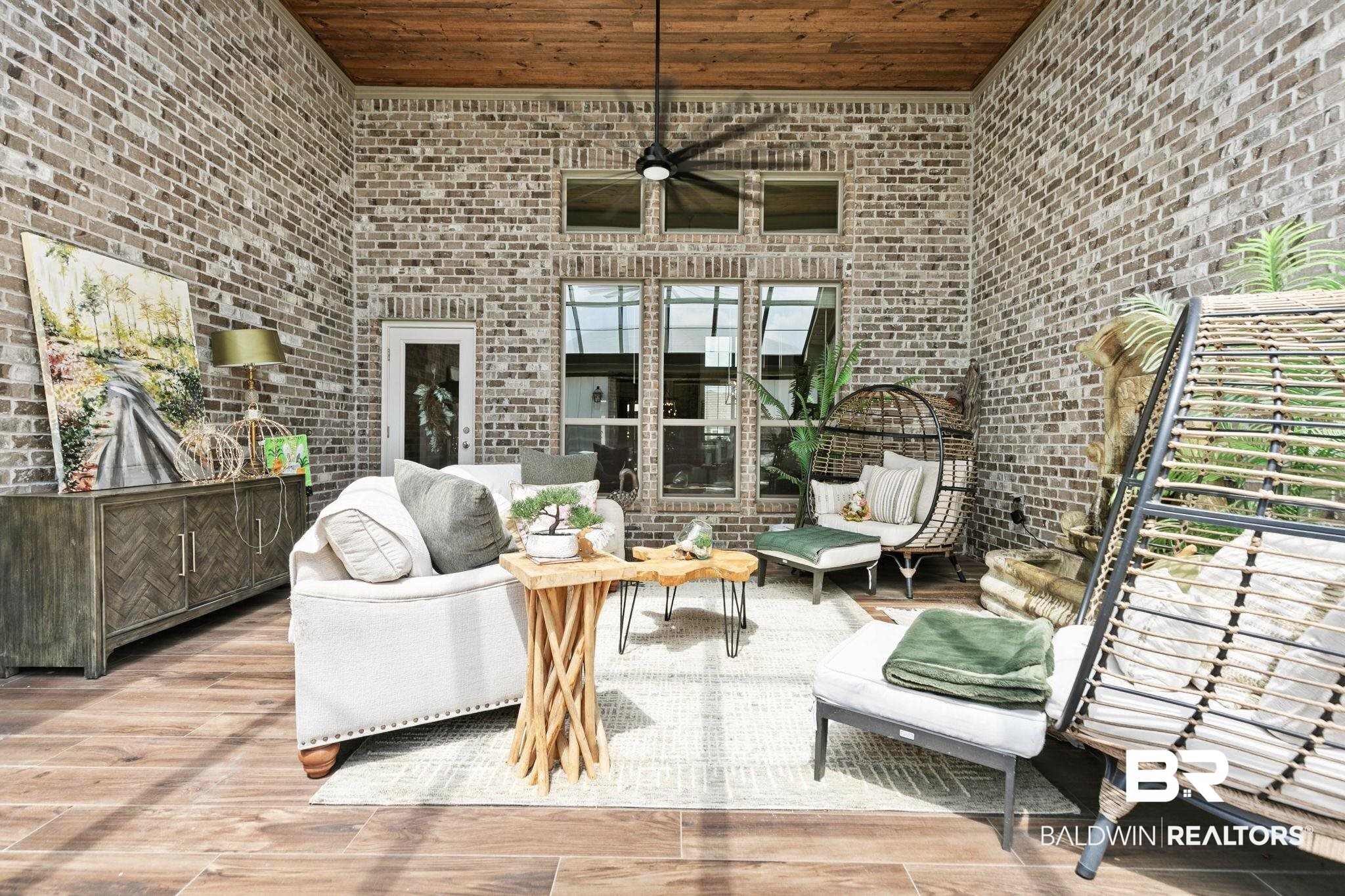 291 Hemlock Drive Fairhope, AL 36532 - Photo 48 of 65 Living area featuring a high wood ceiling, wood finished floors, and brick wall