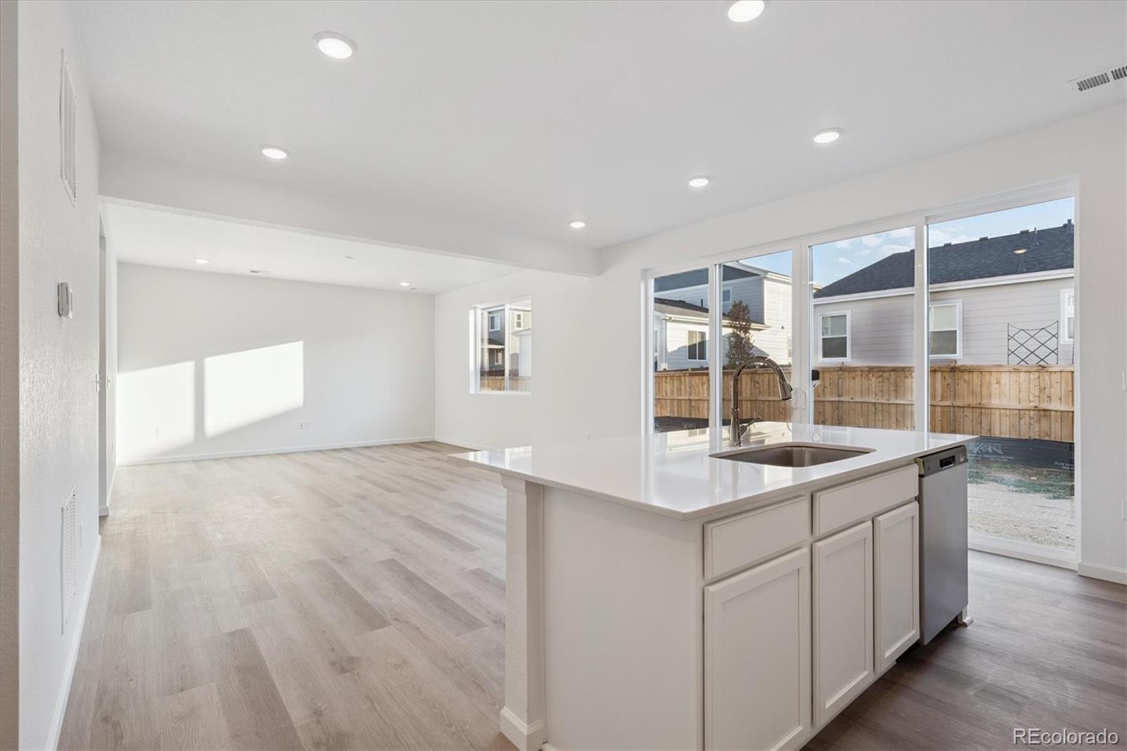 5594 Brangus Drive Windsor, CO 80528 - Photo 10 of 22 a kitchen with a sink stove and cabinets