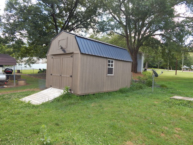 104 Leah Drive Pendleton, SC 29670 - Photo 17 of 17 This charming backyard shed offers additional storage and utility, enhancing any property's functionality.