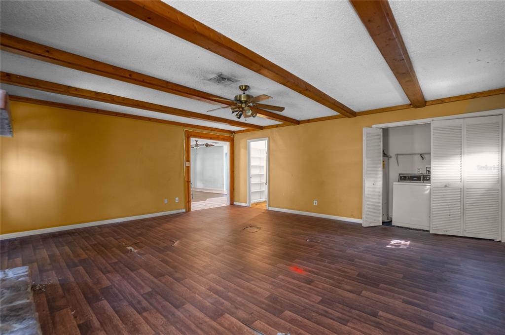 4893 South Old Floral City Road Inverness, FL 34450 - Photo 14 of 31 a view of an empty room with wooden floor and a window