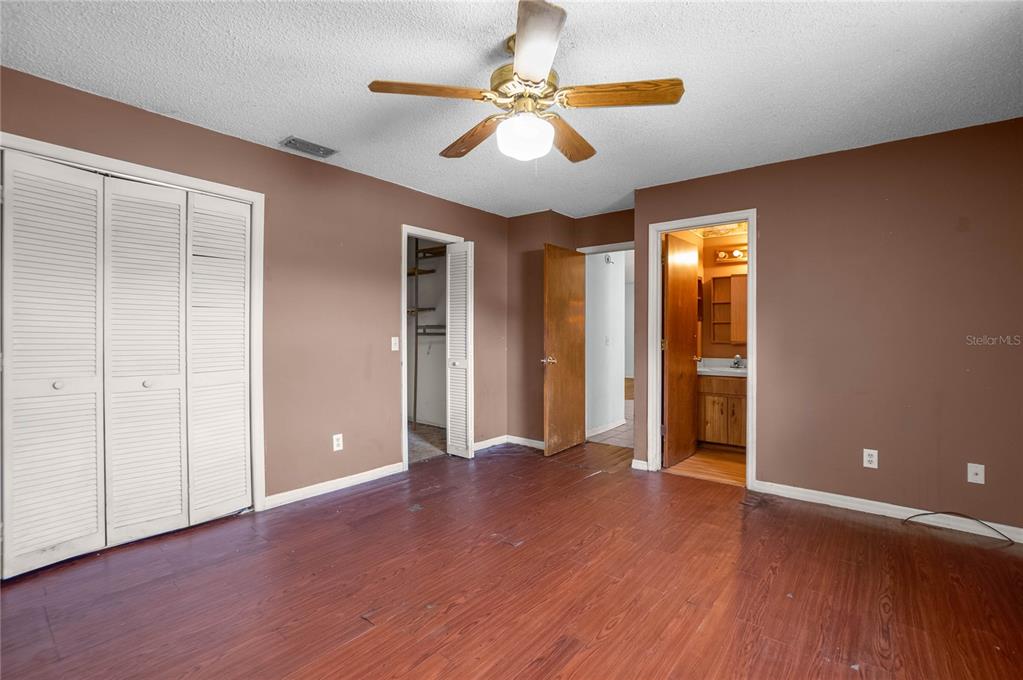 4893 South Old Floral City Road Inverness, FL 34450 - Photo 17 of 31 a view of an empty room with window and wooden floor