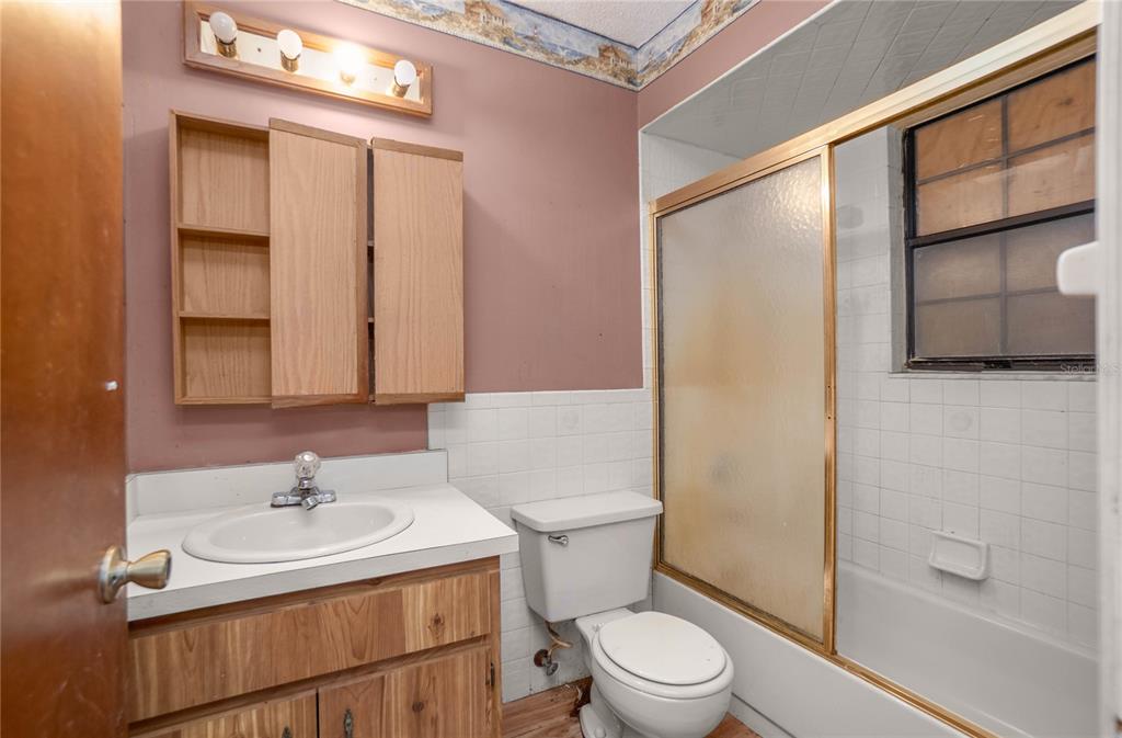 4893 South Old Floral City Road Inverness, FL 34450 - Photo 18 of 31 a bathroom with a sink toilet and shower