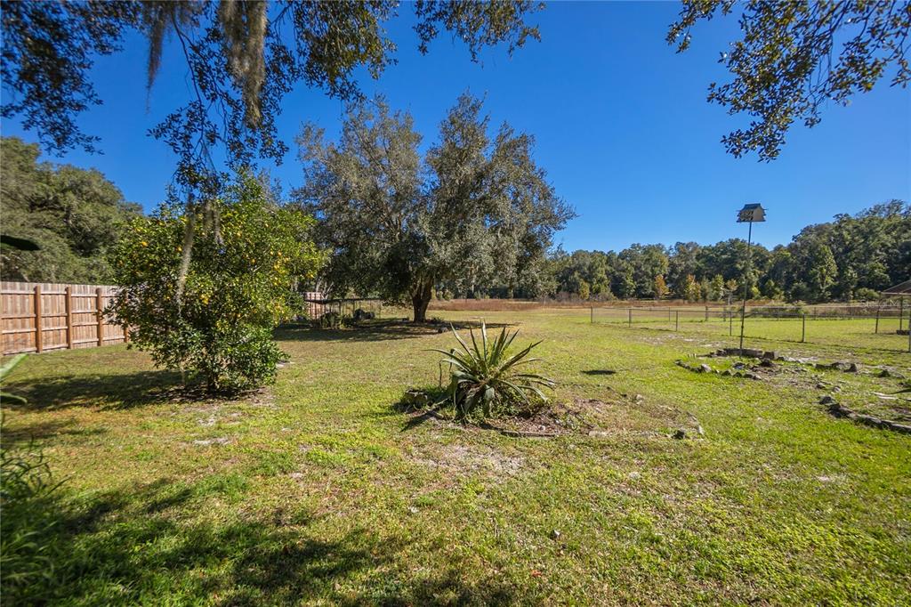 4893 South Old Floral City Road Inverness, FL 34450 - Photo 25 of 31 a view of a lake with houses in the back