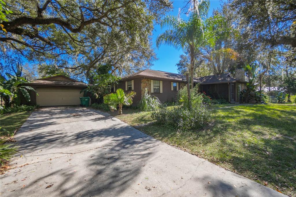 4893 South Old Floral City Road Inverness, FL 34450 - Photo 29 of 31 a view of a house with a yard