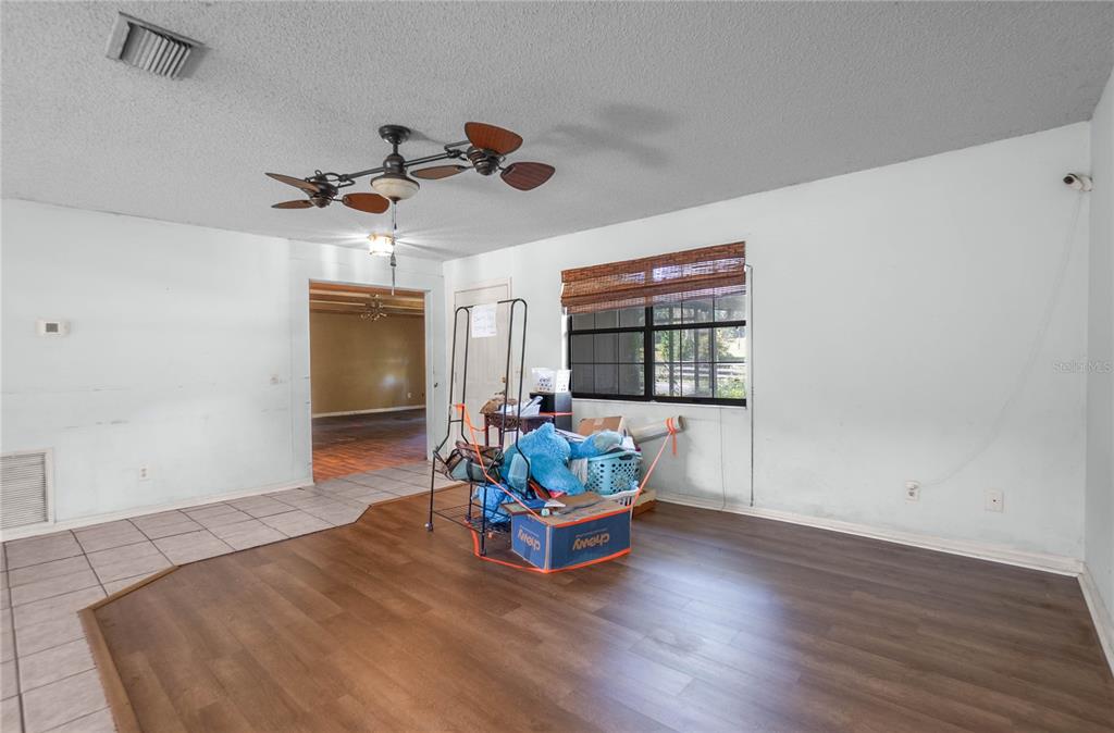 4893 South Old Floral City Road Inverness, FL 34450 - Photo 7 of 31 a living room with furniture window and wooden floor