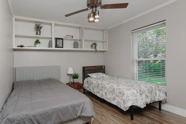 a bedroom with a bed and a window