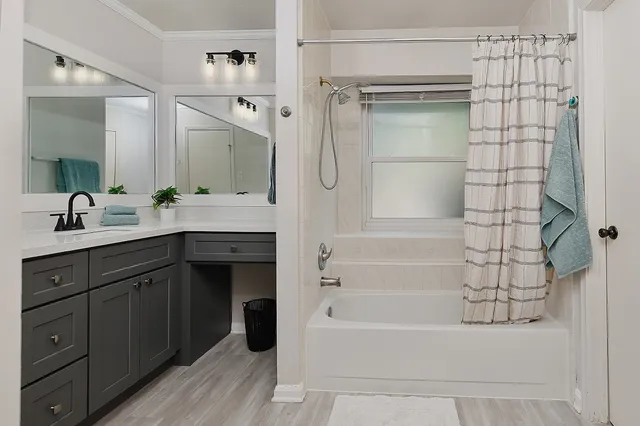 a bathroom with a glass shower door