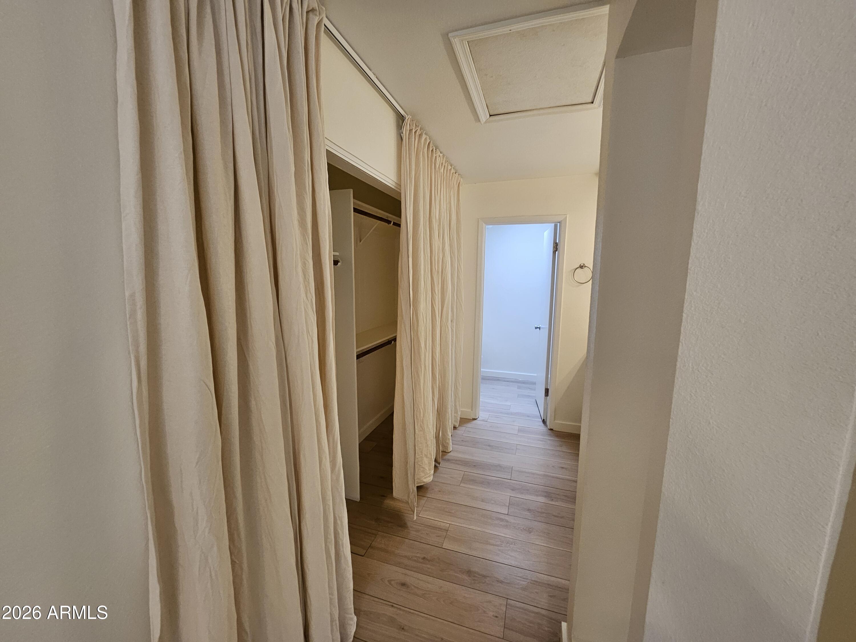 7038 South 42nd Street Phoenix, AZ 85042 - Photo 17 of 22 a view of a hallway with wooden floor