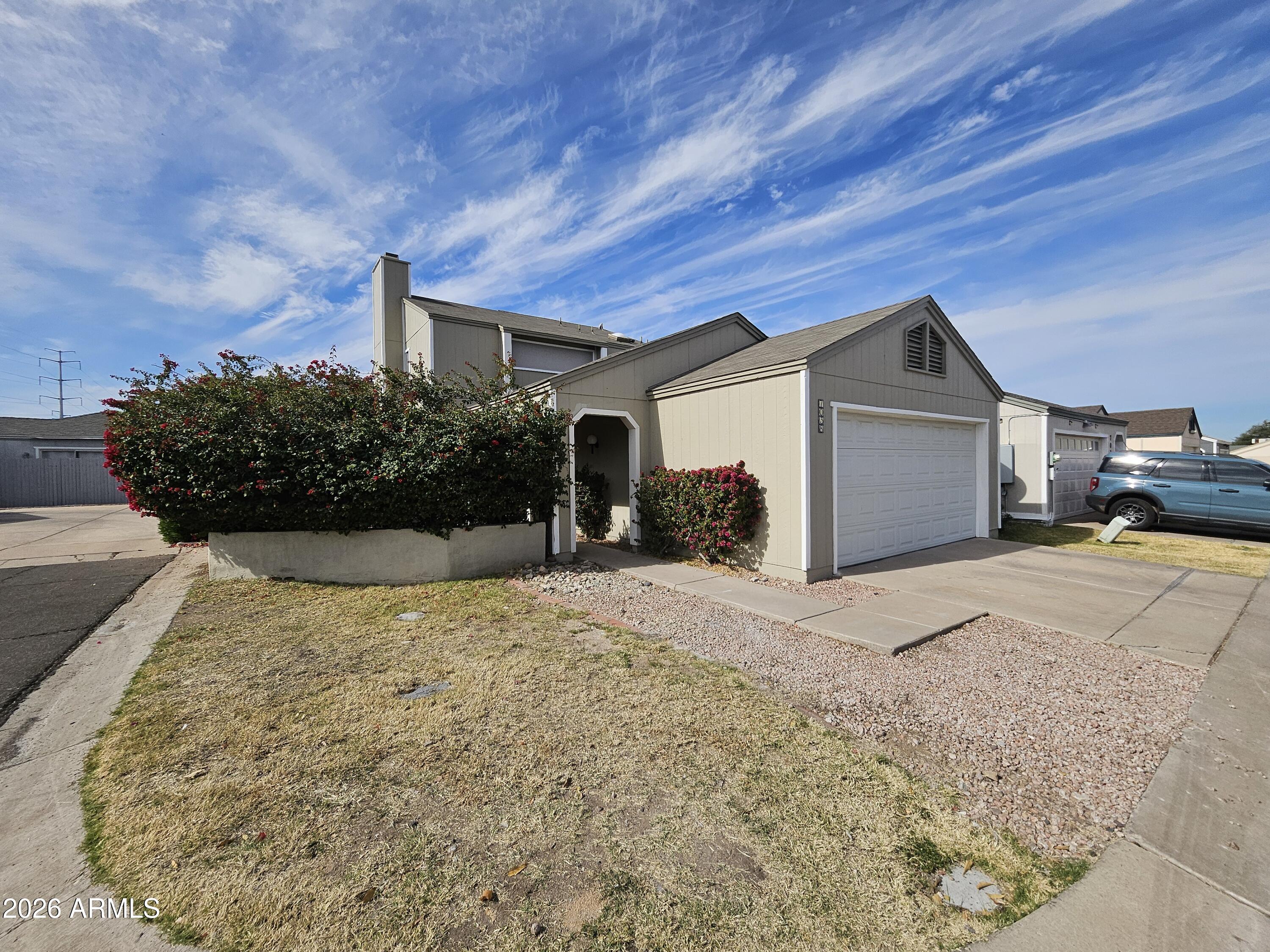7038 South 42nd Street Phoenix, AZ 85042 - Photo 2 of 22 a view of garage and yard