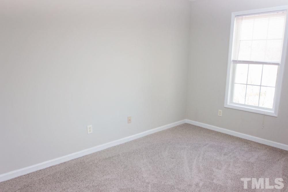 4308 Windstorm Way Raleigh, NC 27616 - Photo 12 of 16 an empty room with a window
