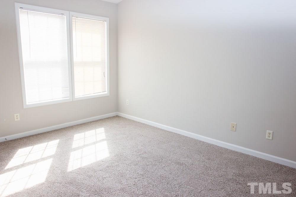 4308 Windstorm Way Raleigh, NC 27616 - Photo 14 of 16 an empty room with a window