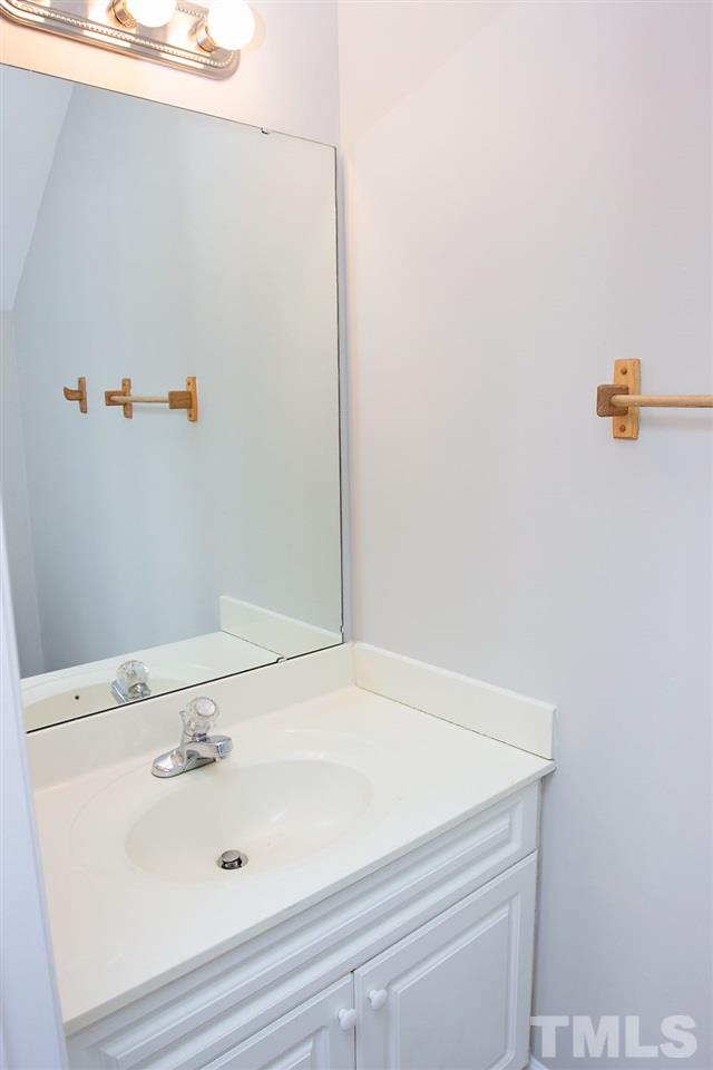 4308 Windstorm Way Raleigh, NC 27616 - Photo 10 of 16 a bathroom with a sink and a vanity