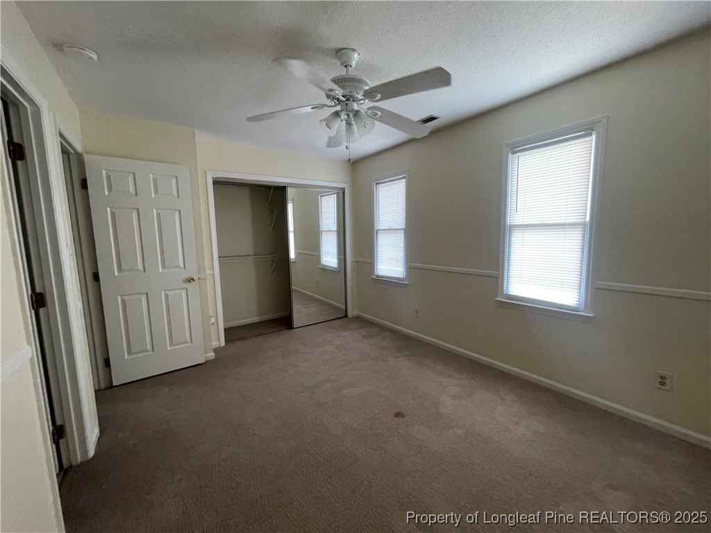 2059 Trexler Court Raleigh, NC 27606 - Photo 14 of 16 an empty room with fan and windows