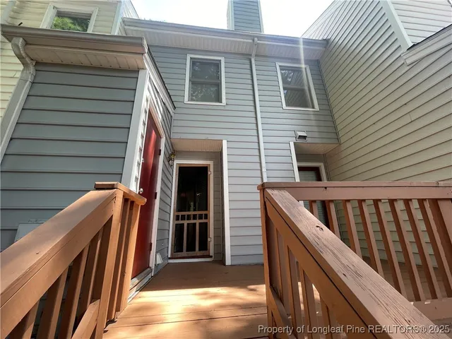 a view of outdoor space with deck and furniture