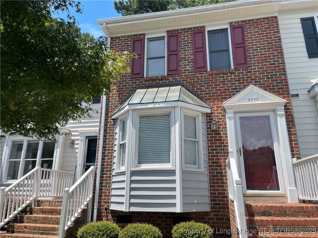 2059 Trexler Court Raleigh, NC 27606 - Photo 2 of 16 a front view of a house with a door