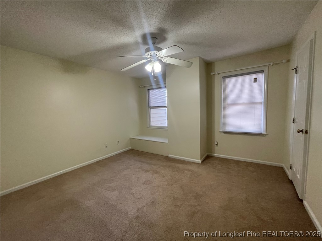 2059 Trexler Court Raleigh, NC 27606 - Photo 7 of 16 an empty room with closet and fan