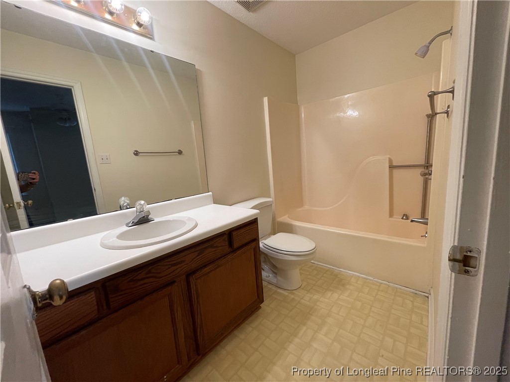 2059 Trexler Court Raleigh, NC 27606 - Photo 10 of 16 a bathroom with a sink a toilet and shower