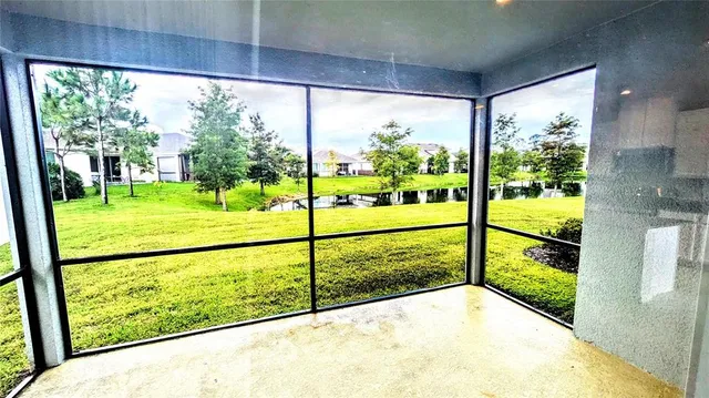 a view of a room with a large window